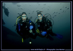 My wife Caroline (on the right) with Sophie under the ice... by Michel Lonfat 